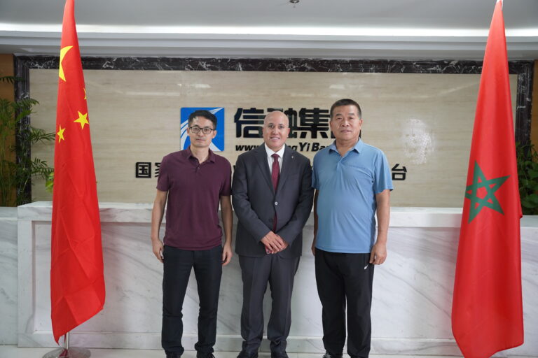 Jiayu Corrosion representatives taking a group photo with the Minister of the Embassy of the Kingdom of Morocco in China after the foreign trade exchange meeting
